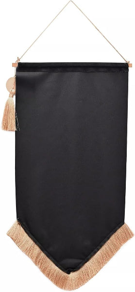 Black banner with beige tassels hanging on a white background