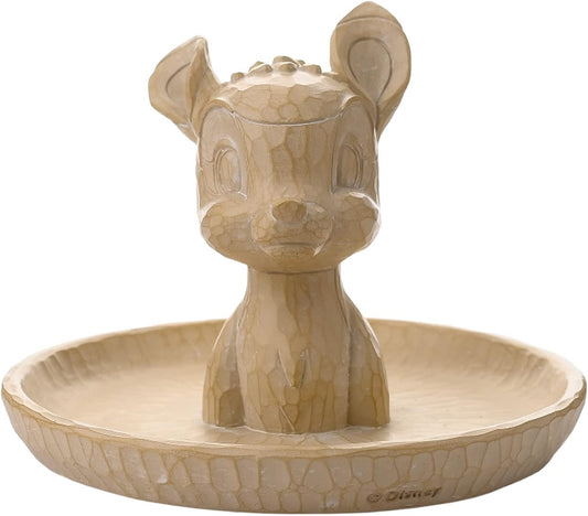 Beige ceramic dish shaped like a cartoon character on a white background
