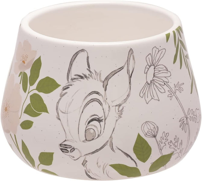 Ceramic planter with a design of a deer and floral elements on a white background