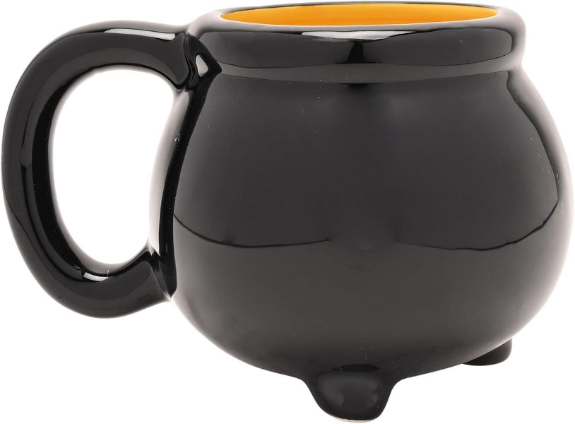 Black mug shaped like a cauldron with a yellow interior on a white background