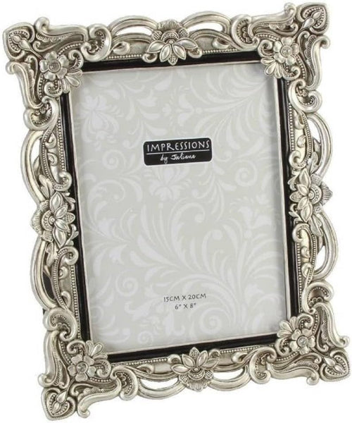 Decorative silver photo frame with 'Impressions by Talisman' branding on a white background