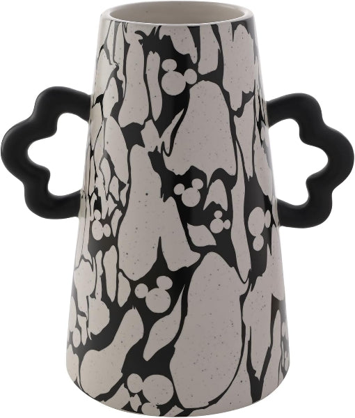 Black and white patterned vase with star-shaped handles on a white background