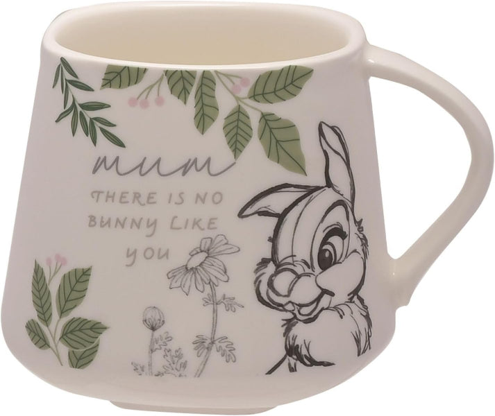 Mug with cartoon bunny design and text on a white background