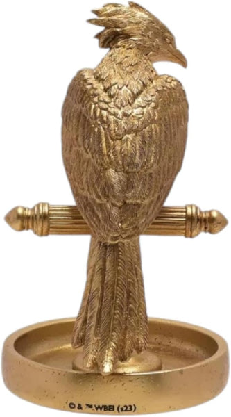 Gold bird-shaped object on a white background