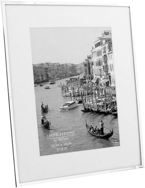 White picture frame with a black and white photo of a canal scene.