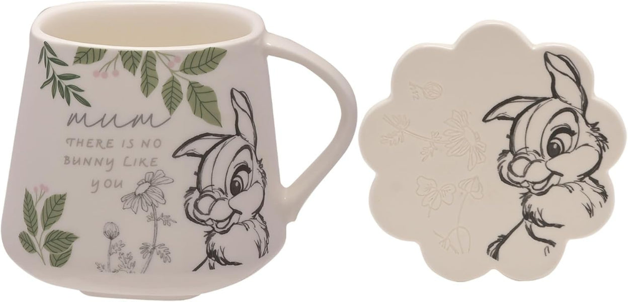 Mug and coaster set with cartoon character design featuring text.