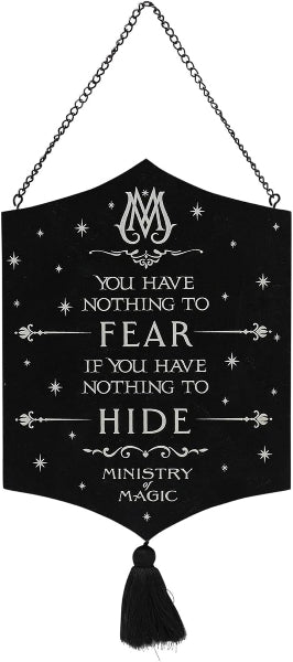 Decorative sign with text and tassel, featuring the phrase 'You have nothing to fear if you have nothing to hide' and 'Ministry Magic'.