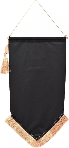 Black banner with beige tassels hanging against a white background