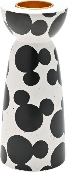 Cylindrical ceramic vase with black dot pattern on a white background