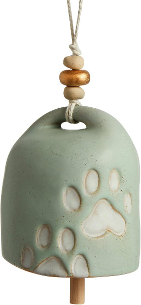 Ceramic bell with paw prints and wooden beads on a white background