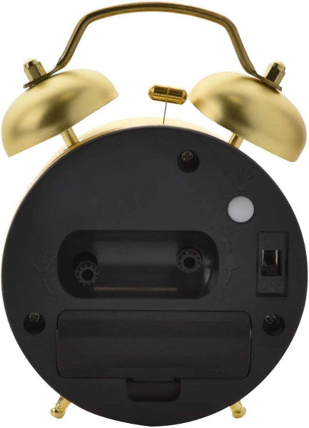 Back view of a black alarm clock with gold bells on a white background