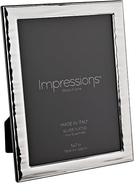 Silver photo frame with 'Impressions' branding on a black background