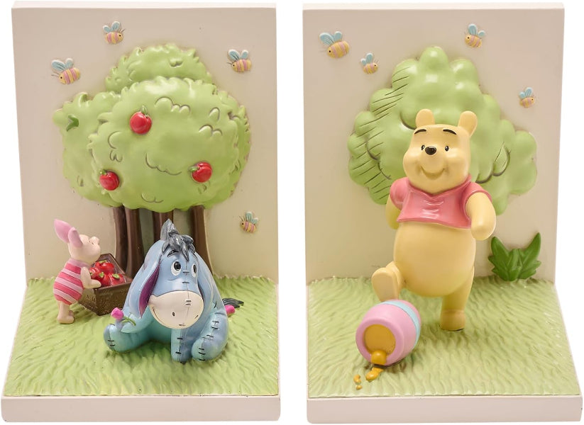 Two panels showing Winnie the Pooh and friends with a tree and flowers in the background.