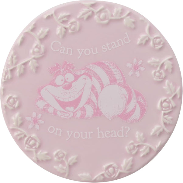 Pink decorative plate with a cartoon character and text on a white background