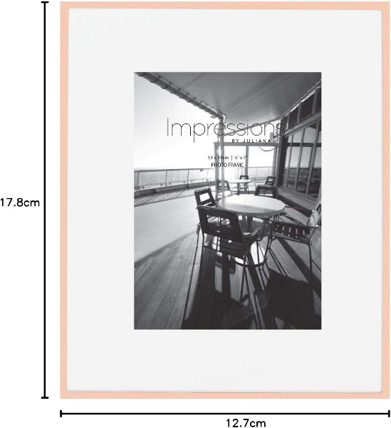 Framed black and white photo of a patio with dimensions displayed