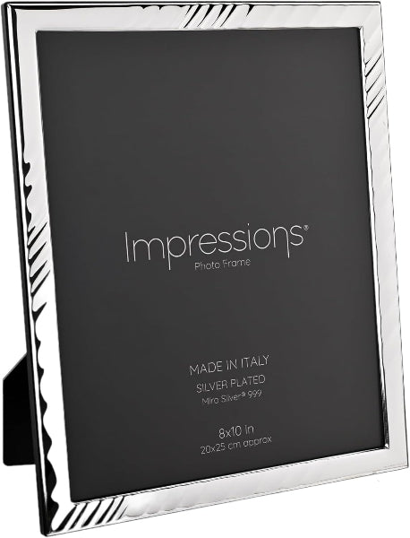 A silver-plated picture frame with a decorative striped corner design, shown holding a black photo insert. The insert displays the brand name 'Impressions' and product details.