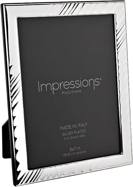 Silver photo frame with 'Impressions' branding on a black background