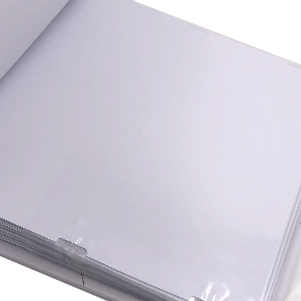Close-up of a clear plastic sheet with a metal clip on a white background