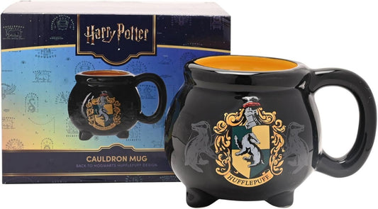 Black mug with Hufflepuff crest from Harry Potter series, next to its packaging.