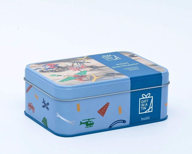 Blue rectangular tin with colorful illustrations on a white background