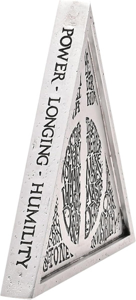 Triangular sculpture with engraved text on a white background