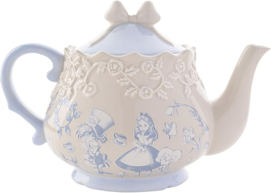 Decorative teapot with Alice in Wonderland design on a white background