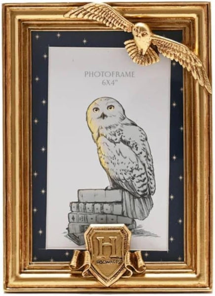 Gold photo frame with owl design and 'H' emblem on a navy background