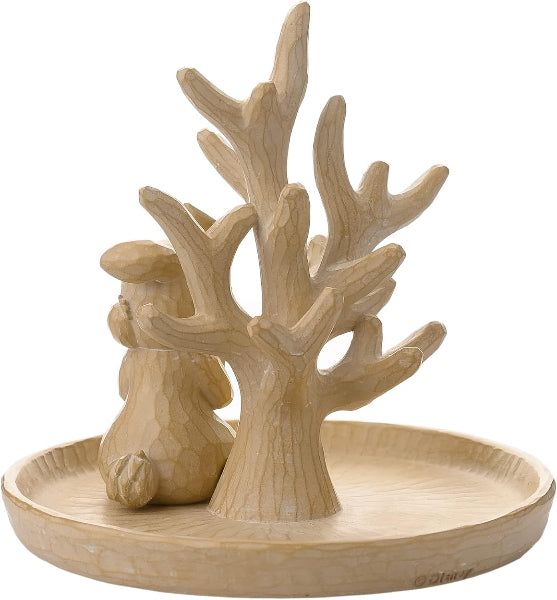Decorative piece with a deer and tree design on a round base