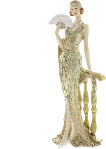 Mannequin wearing a vintage-style dress with a fan on a white background