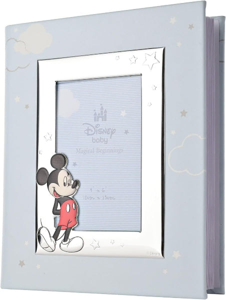 A Disney baby photo album with a light blue cover decorated with white clouds and stars, featuring a silver-toned frame and a cartoon Mickey Mouse illustration on the front