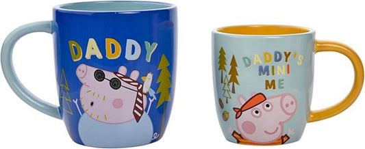 Two mugs featuring cartoon pigs with text, one blue and one yellow.