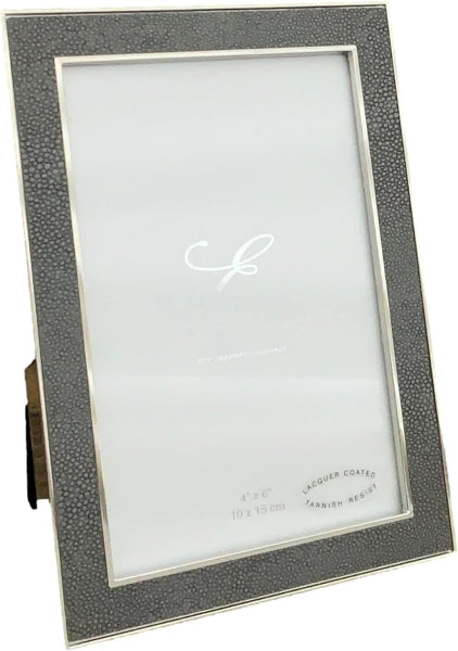 A 4x6 picture frame with a textured dark gray shagreen border and a silver-toned metal frame, shown standing on a small metal easel bracket against a white background.