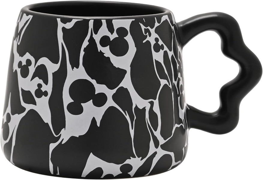 Black mug with white abstract pattern on a white background