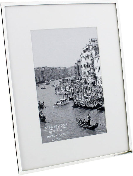 White picture frame with a black and white photo of a canal scene with boats and buildings.