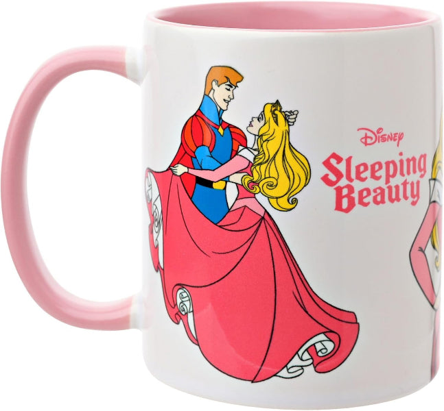 A white ceramic mug with a pink handle and interior, featuring a colorful illustration of Disney's Sleeping Beauty with the Disney logo and character art printed on the side.