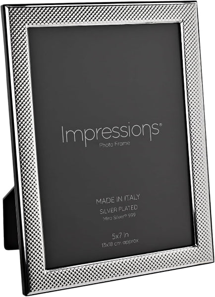 Silver photo frame with textured border on a white background