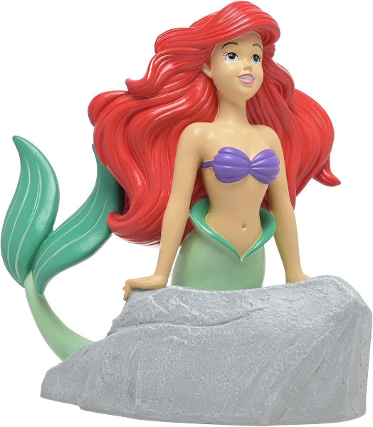 Mermaid figurine with red hair and green tail on a white background