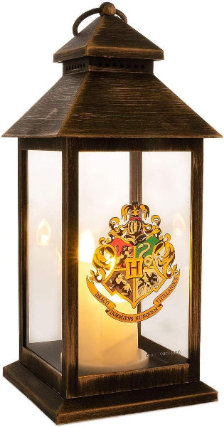 Decorative lantern with a glowing candle inside, featuring a prominent emblem.