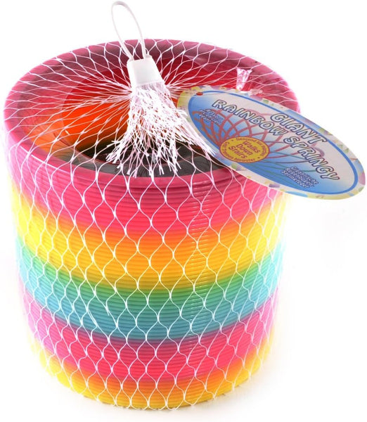 Stack of rainbow-colored giant springs in a net bag with a tag on a white background