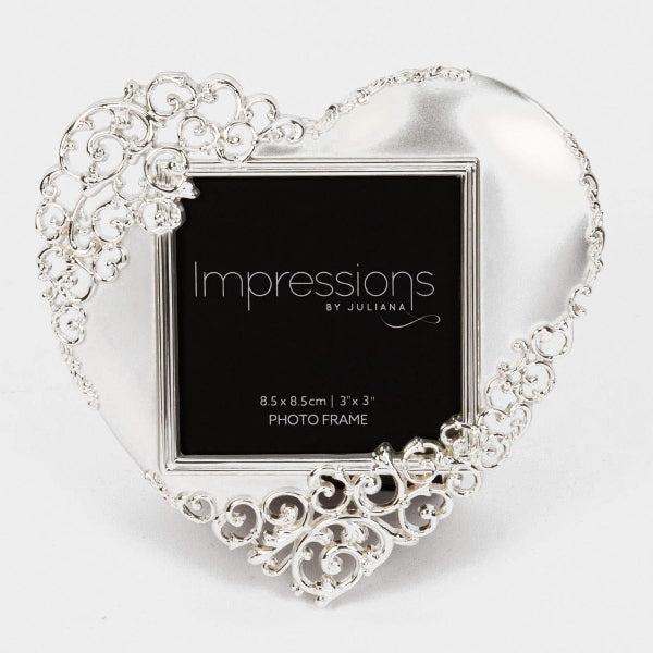 Decorative heart-shaped photo frame with intricate designs on a white background