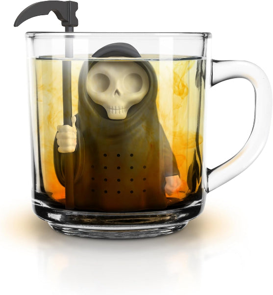 Glass mug with a skeleton tea infuser inside, filled with tea.
