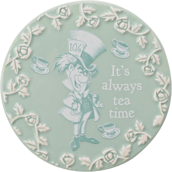 Decorative plate with Mad Hatter design and 'It's always tea time' text on a light green background.