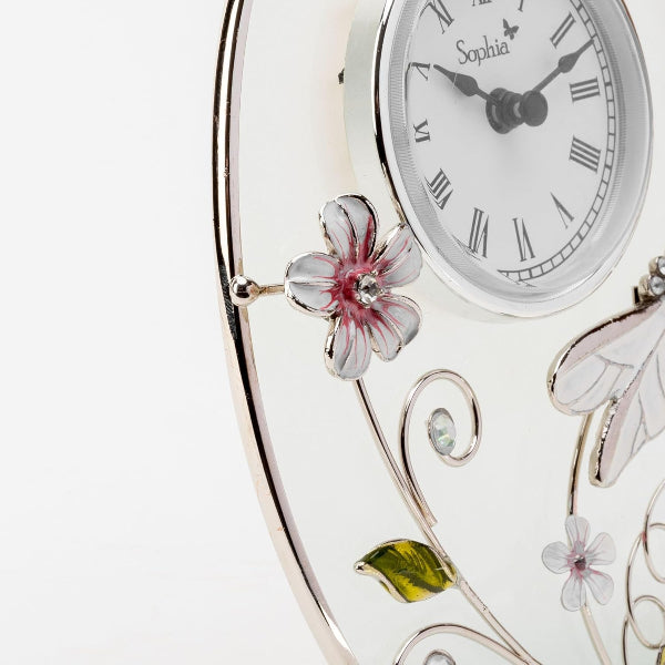 Decorative clock with floral designs on a white background