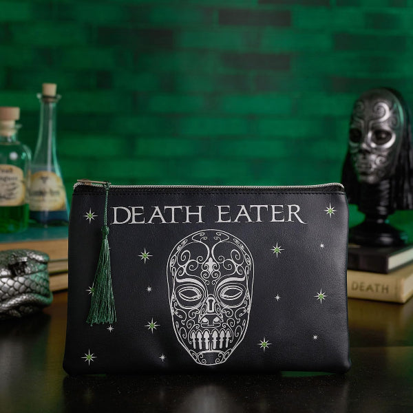 Black pouch with 'DEATH EATER' text and skull design on a green brick wall background.