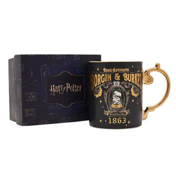 Black mug with gold text and design, featuring 'Harry Potter' branding, next to a matching box on a white background.