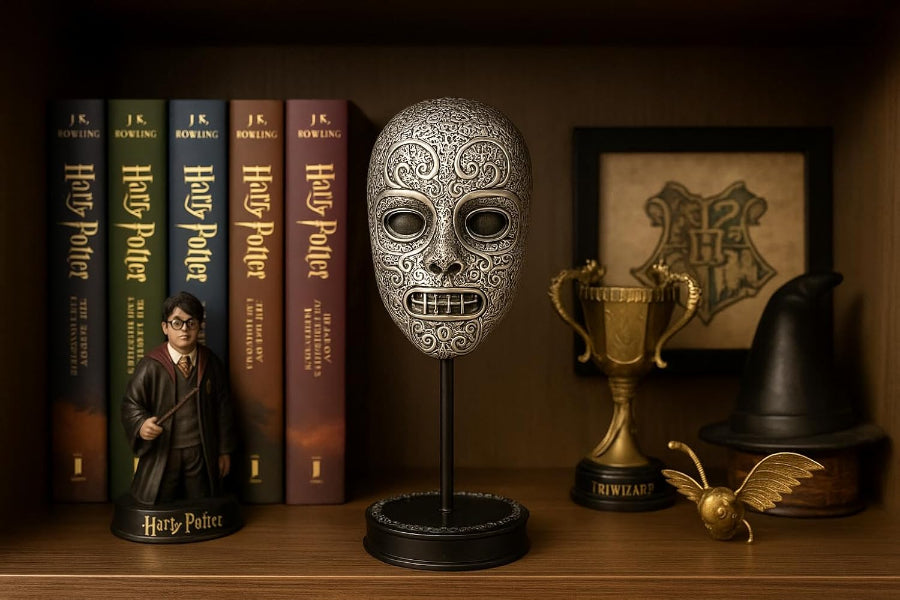 Decorative mask on a stand with 'Harry Potter' books and other memorabilia in the background.