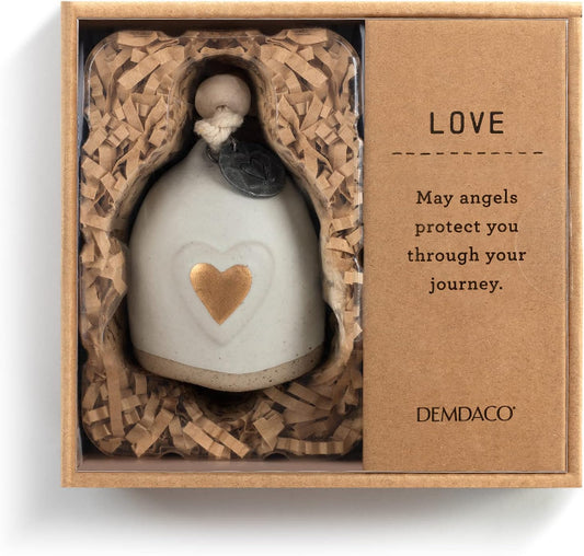 A ceramic angel figurine with a white body, gold heart, and dark glass eyes, presented inside a kraft gift box with shredded paper and a card that reads 'LOVE' and 'DEMDAO'.