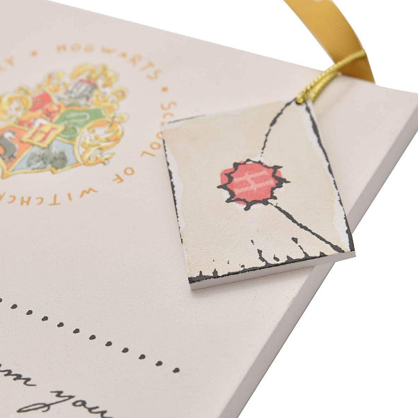 Enrollment letter with Hogwarts crest on a white background
