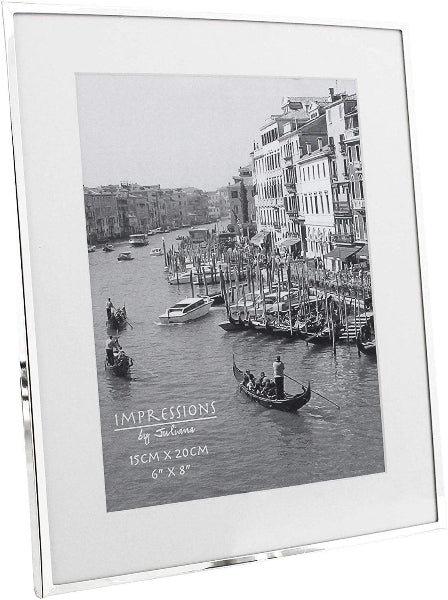 Silver photo frame with a scenic view of a canal and buildings.