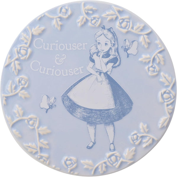 Decorative plate with Alice in Wonderland design on a light blue background